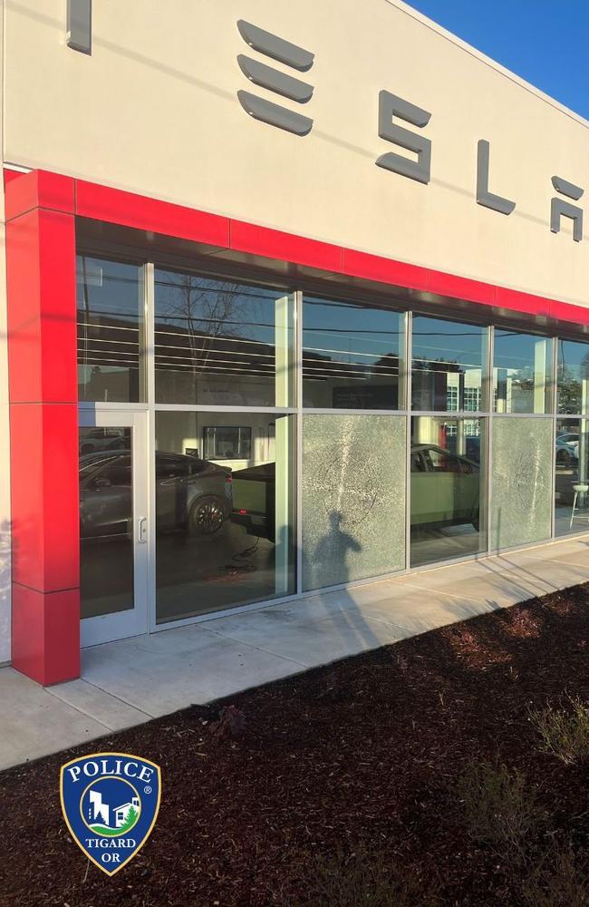 <!DOCTYPE html PUBLIC "-//W3C//DTD HTML 4.0 Transitional//EN" "http://www.w3.org/TR/REC-html40/loose.dtd"><html><body><p>The windows of a Tesla dealership in Oregon were reportedly sprayed with bullets. Picture:Tigard Police Department</p></body></html>