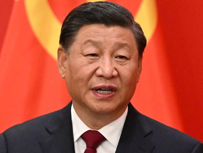 (FILES) This file photo taken on October 23, 2022 shows China's President Xi Jinping speaking during the introduction of members of the Chinese Communist Party's new Politburo Standing Committee, the nation's top decision-making body, to the media in the Great Hall of the People in Beijing. - China's leader Xi Jinping will glide into his third term in power bruised but unbowed by the mass protests, deadly Covid wave and economic malaise that have afflicted his rule in recent months. (Photo by Noel CELIS / AFP)