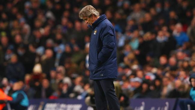 Manuel Pellegrini manager of Manchester City looks despondent.