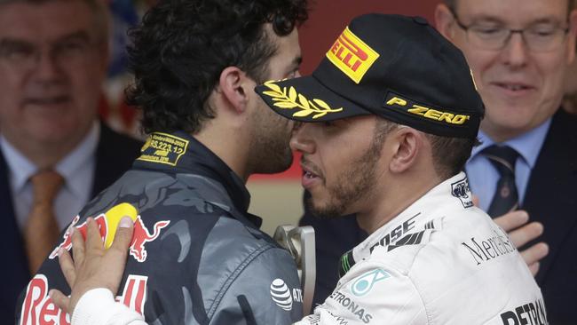 Lewis Hamilton commiserates with Daniel Ricciardo after the Red Bull controversy.
