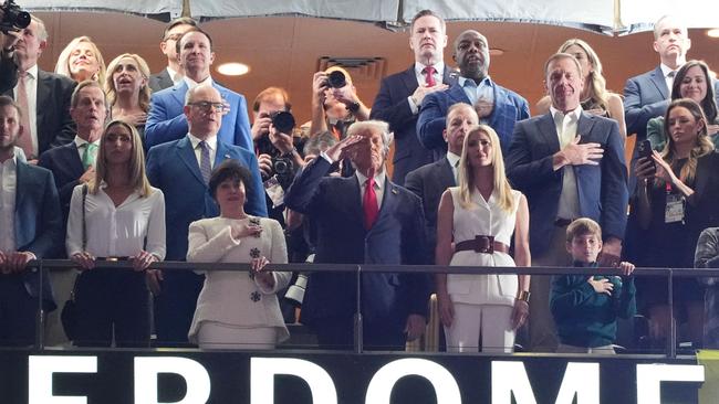 US President Donald Trump stands as US singer-songwriter Jon Baptiste performs the National Anthem ahead of Super Bowl LIX. Picture: AFP