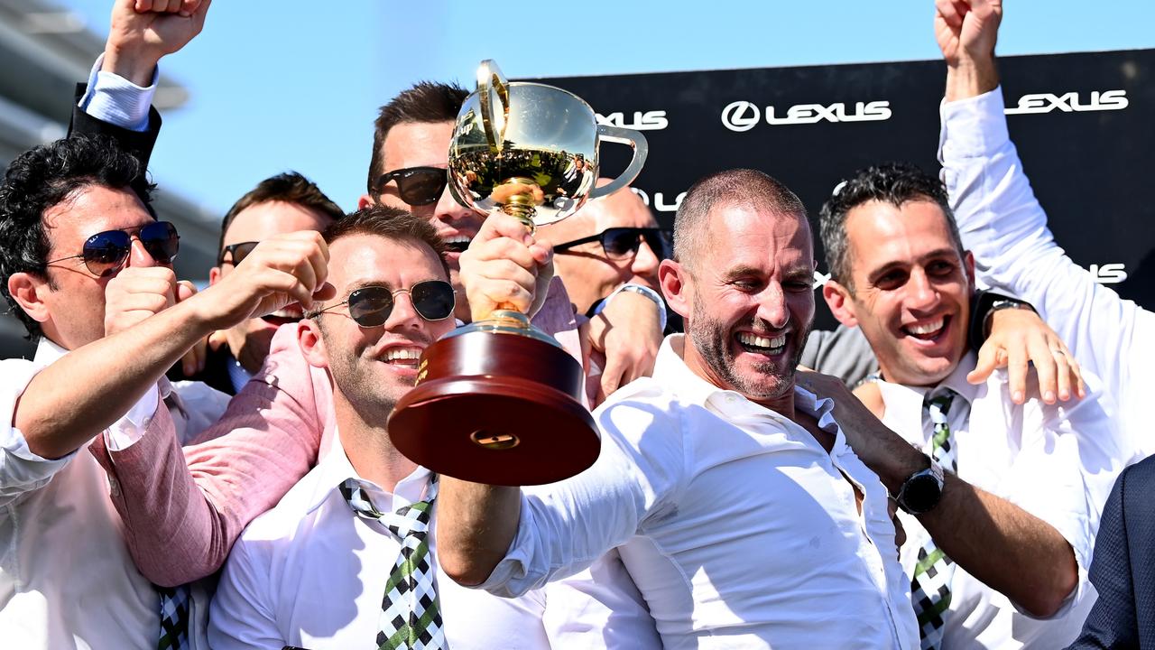 MELBOURNE, AUSTRALIA - NOVEMBER 02: Verry Elleegant owners Brae Sokolski and Ozzie Kheir celebrate with the Lexus Melbourne Cup after James Mcdonald rode #4 Verry Elleegant to victory in race 7, the Lexus Melbourne Cup during 2021 Melbourne Cup Day at Flemington Racecourse on November 02, 2021 in Melbourne, Australia. (Photo by Quinn Rooney/Getty Images)
