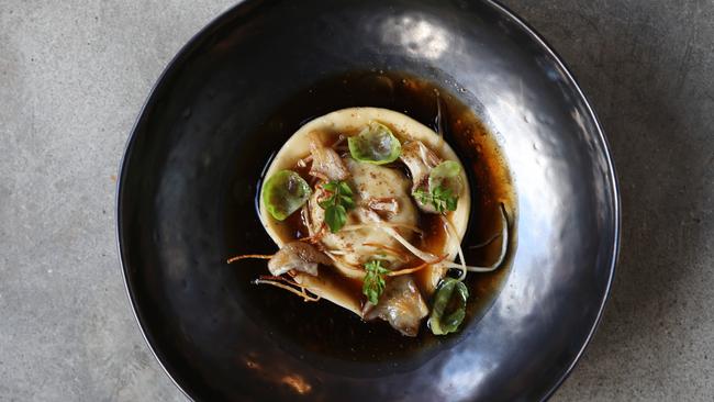 The large raviolo in porcini broth. Picture: REBECCA MICHAEL