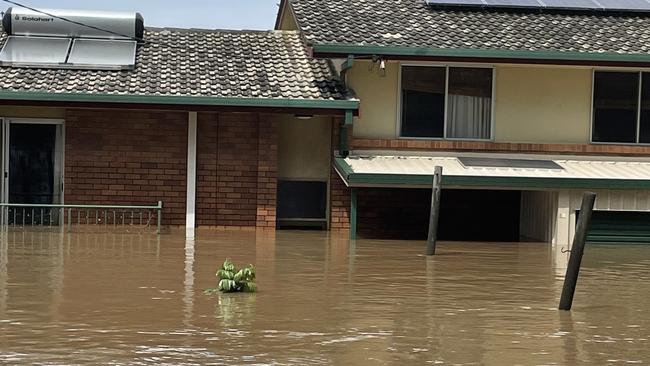 The Delaney's Broadwater home underwater during the floods early last year.