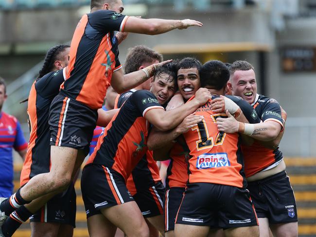 SG Ball: Tigers celebrate a try by number 17, Sione Vaihu. Picture: David Swift