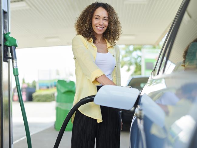 woman filling up at the petrol pump