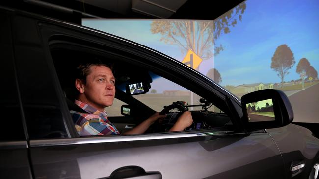 CARRS-Q ... Research officer David Rodwell using the driving simulator at CARRS-Q road safety centre at QUT. Pic: Tara Croser.