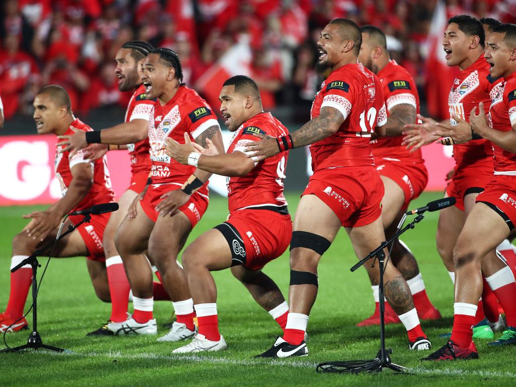 Tonga players perform the Sipi Tau or Tongan war cry. Picture: Fiona Goodall / AFP