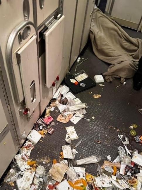 Food and cutlery strewn across the galley kitchen of the Boeing plane. Picture: Twitter