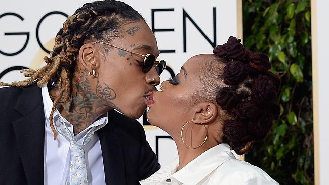 Too far? Star locks lips with mum on red carpet