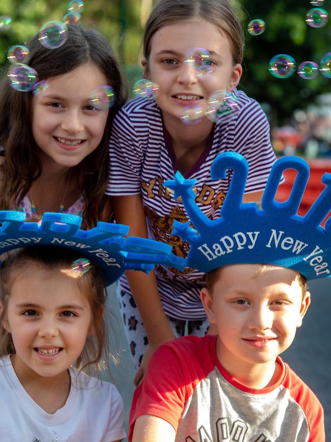 Annabelle, 10, Chloe, 9, at back and Emilia Nastevski, 6, and Jacob Damevski, 8, in front at Yarra Park. Picture: Jay Town