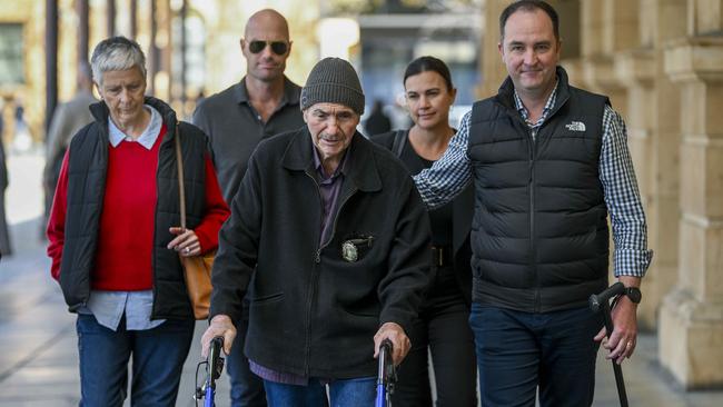 Surrounded by family and friends Dean Harrison, son of murder victim Phyllis Harrison, leaves court in Adelaide. Picture: Mark Brake