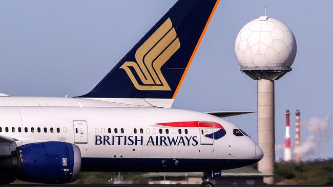 TA British Airways Boeing 787 Dreamliner alongside a Singapore Airlines Airbus A380. Picture: AFP