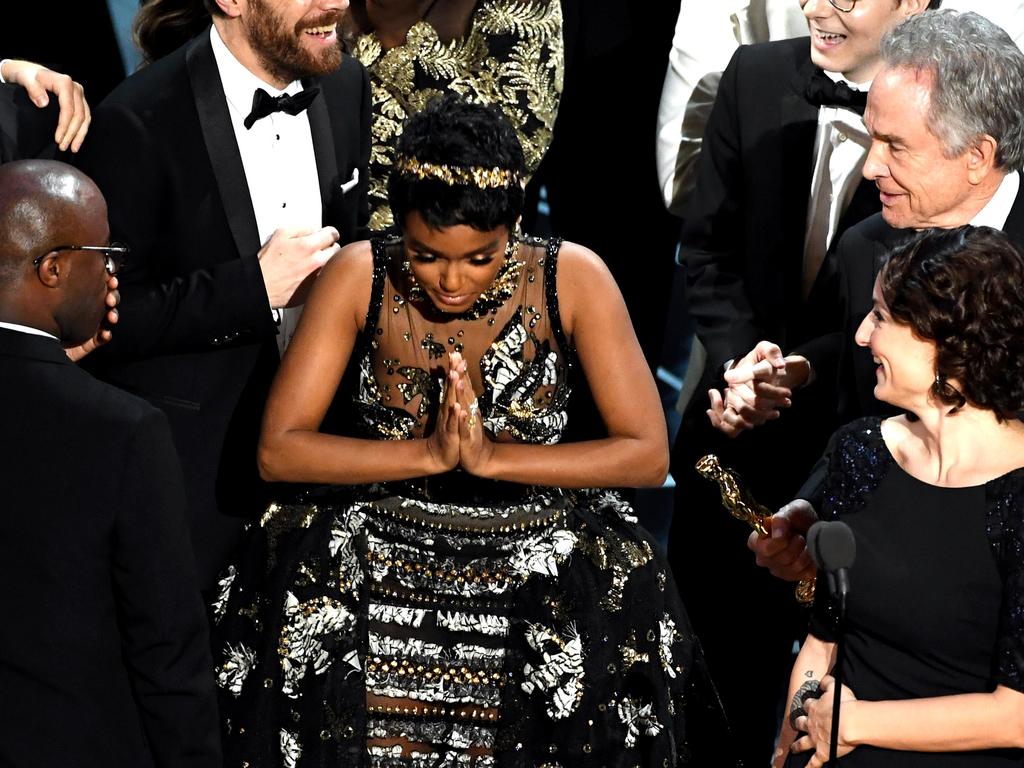 Producer Adele Romanski , actor Ashton Sanders, writer/director Barry Jenkins and actor/singer Janelle Monae accept Best Picture for ‘Moonlight’ during the 89th Annual Academy Awards. Picture: AFP