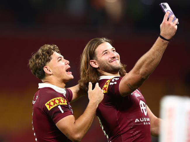 (L-R) Reece Walsh and Patrick Carrigan of the Maroons take a selfie after winning game two of the State of Origin series. Picture: Getty Images