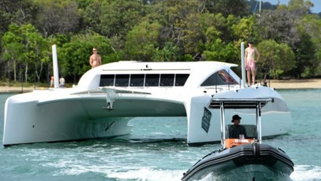 Tony Longhurst's 20m catamaran Kato leaves the Noosa River. Photo: Peter Gardiner