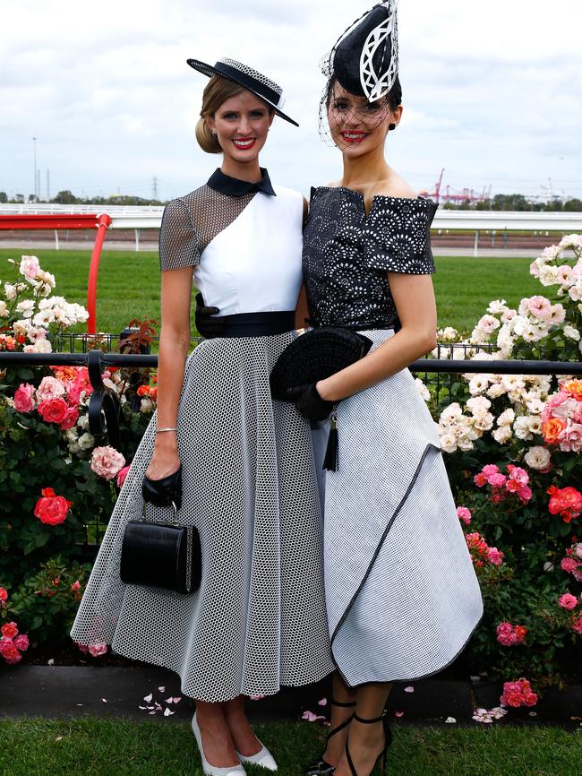 (L-R) Myer Fashions on the Field Women's Racewear winner Courtney Moore and second place Charlotte Moor pose in the Fashion on the Field enclosure on Victoria Derby Day at Flemington Racecourse on October 31, 2015 in Melbourne, Australia. Picture: Zak Kaczmarek/Getty Images for the VRC.