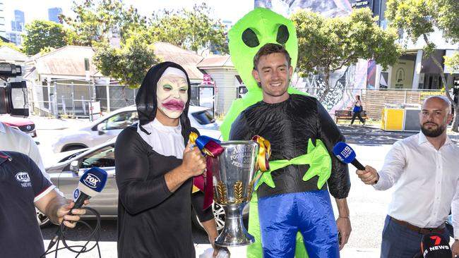 Cam Rayner (left) and Harris Andrews (right) pose with the premiership cup at the start of Mad Monday celebrations Monday, September 30, 2024 – (Photo by Richard Walker)