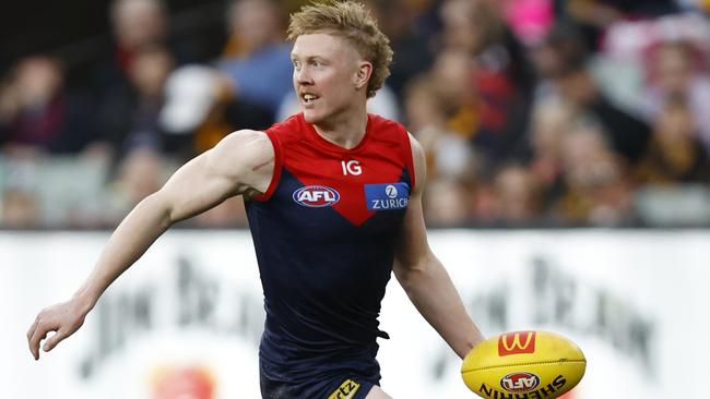 MELBOURNE, AUSTRALIA - AUGUST 20: Clayton Oliver of the Demons runs with the ball during the round 23 AFL match between Melbourne Demons and Hawthorn Hawks at Melbourne Cricket Ground, on August 20, 2023, in Melbourne, Australia. (Photo by Darrian Traynor/Getty Images)