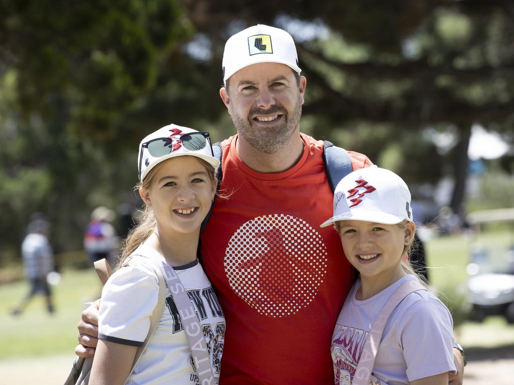 LIV Golf fans Milla, Sam and Airlie Devitt on Saturday. Picture: Brett Hartwig