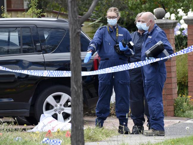 Police at the scene where a man was shot multiple times and later died from his injuries. Picture: Andrew Henshaw