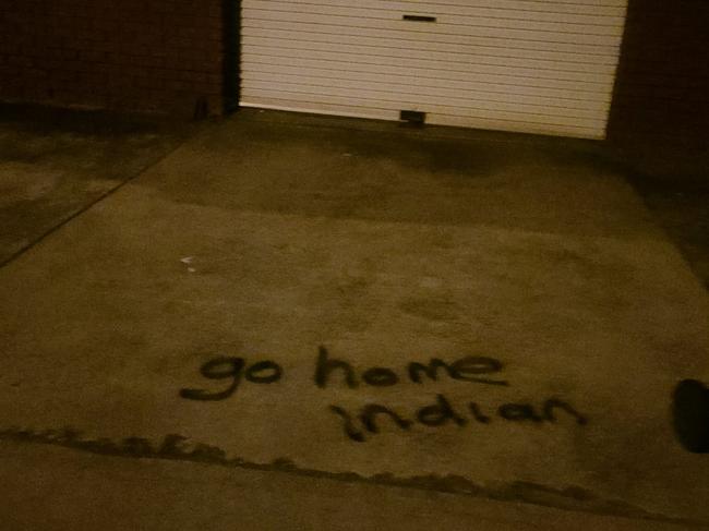 Racist graffiti painted in Mr Singh's driveway.