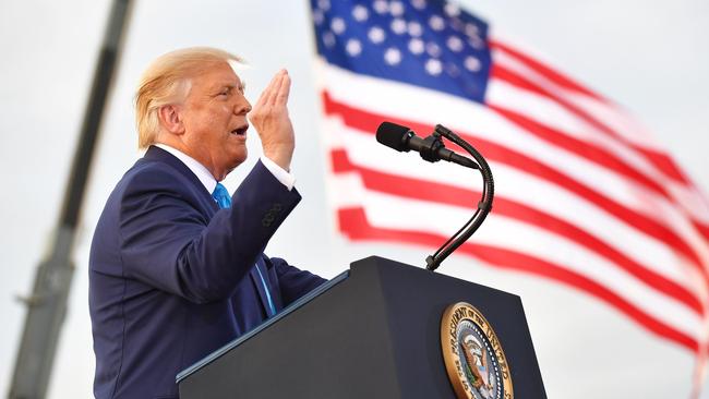 US President Donald Trump addresses supporters during a campaign event at Arnold Palmer Regional Airport in Latrobe, Pennsylvania.