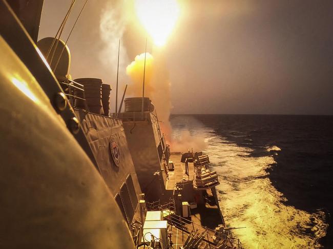 TOPSHOT - This handout picture courtesy of the US Navy taken on October 19, 2023 shows the Arleigh Burke-class guided-missile destroyer USS Carney (DDG 64) defeating a combination of Houthi missiles and unmanned aerial vehicles in the Red Sea. A US Navy ship in the Red Sea on October 19, 2023 shot down missiles and drones that had been fired by Iran-backed Huthi rebels in Yemen, possibly at Israel, the Pentagon said. Three "land-attack cruise missiles and several drones" were intercepted by a destroyer, Pentagon spokesman Brigadier General Pat Ryder told reporters. The attack was "launched by Huthi forces in Yemen" potentially toward targets in Israel, he added. Thousands of civilians, both Palestinians and Israelis, have died since October 7, 2023, after Palestinian Hamas militants based in the Gaza Strip entered southern Israel in an unprecedented attack triggering a war declared by Israel on Hamas with retaliatory bombings on Gaza. (Photo by Aaron Lau / US NAVY / AFP) / RESTRICTED TO EDITORIAL USE - MANDATORY CREDIT "AFP PHOTO / ASSEMBLEE NATIONALE 2022" - NO MARKETING NO ADVERTISING CAMPAIGNS - DISTRIBUTED AS A SERVICE TO CLIENTS