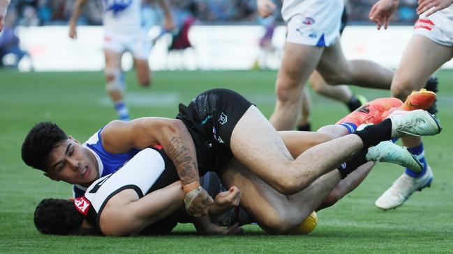 Paul Curtis was given a three-week ban for this tackle. Picture: James Elsby/AFL Photos via Getty Images