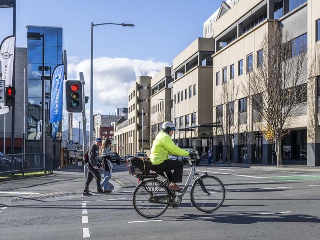 Cyclist on the intersection of Collins and Barrack Street - New bike lanes and parklets proposed. Picture: Caroline Tan