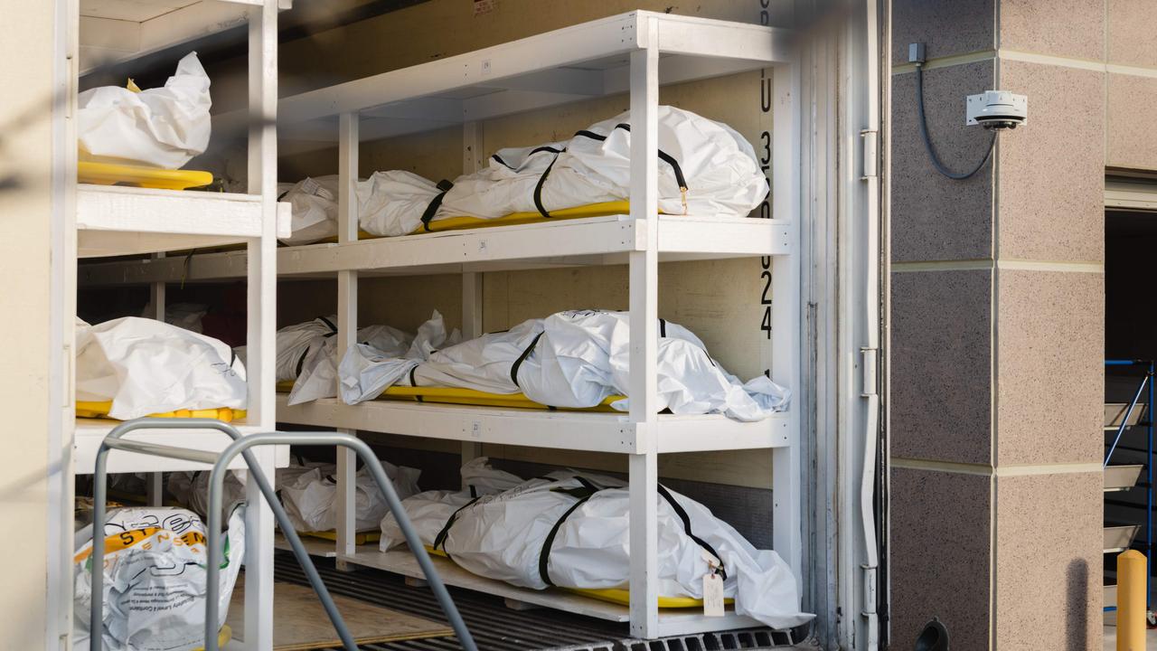 Bodies wrapped in plastic line the walls inside a refrigerated trailer in El Paso, Texas. Picture: Justin Hamel/AFP