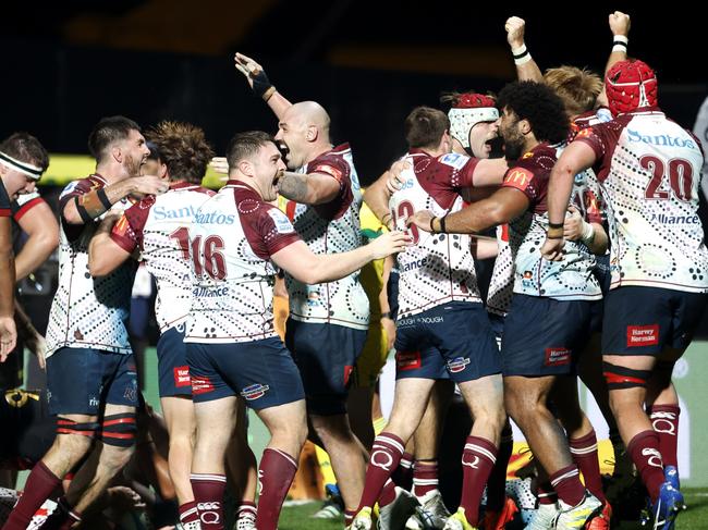 NEW PLYMOUTH, NEW ZEALAND - MAY 12: The Reds celebrate after winning the round 12 Super Rugby Pacific match between Chiefs and Queensland Reds at Yarrow Stadium, on May 12, 2023, in New Plymouth, New Zealand. (Photo by Andy Jackson/Getty Images)