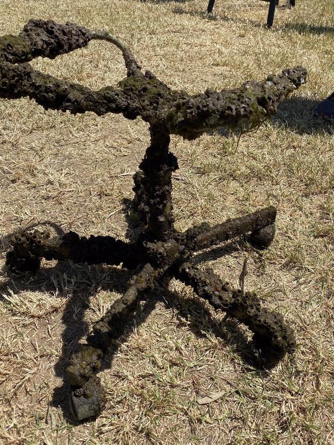 A barnacle covered chair pulled from the Maribyrnong River.