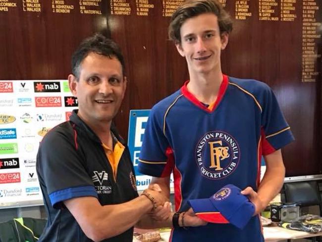 Sam Sturt receives his Frankston Peninsula First XI cap from coach Keith Jansz.