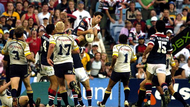 Anthony Minichiello flies high for the Roosters against the Cowboys in 2004.