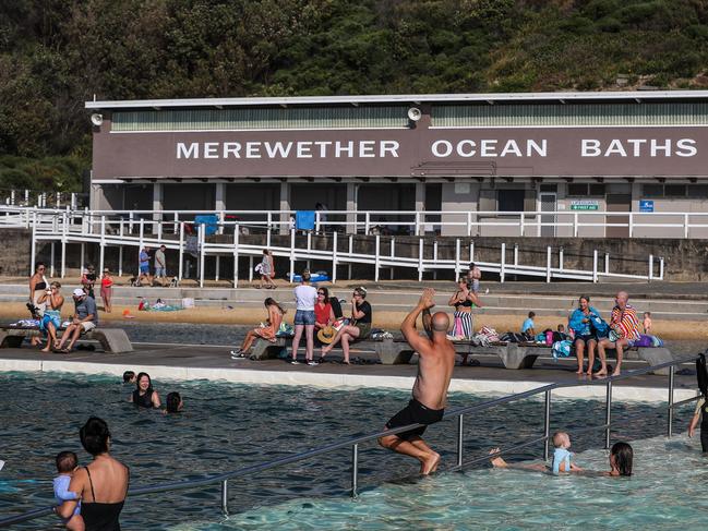 People take a morning swim at Merewether Ocean Baths on Christmas Day in Newcastle. Picture: Roni Bintang/Getty Images