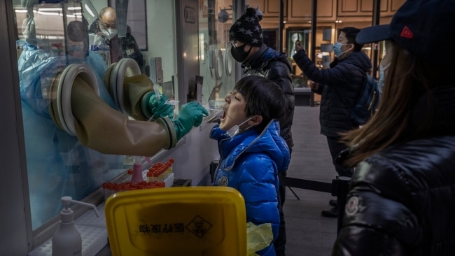 A boy is swabbed by a health worker at a private testing site on January 17 in Beijing, China. Picture: Kevin Frayer/Getty Images