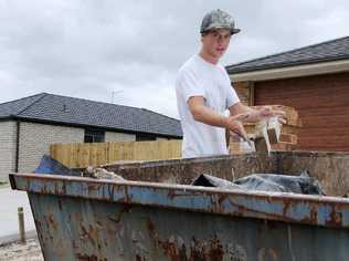 Luke Jeffries tidies up a housing construction site – an increasingly expensive activity under new state laws. Picture: Renee Pilcher