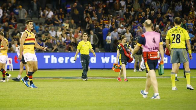 Taylor Walker speaks to umpire Troy Pannell at three-quarter time. Picture: Wayne Ludbey