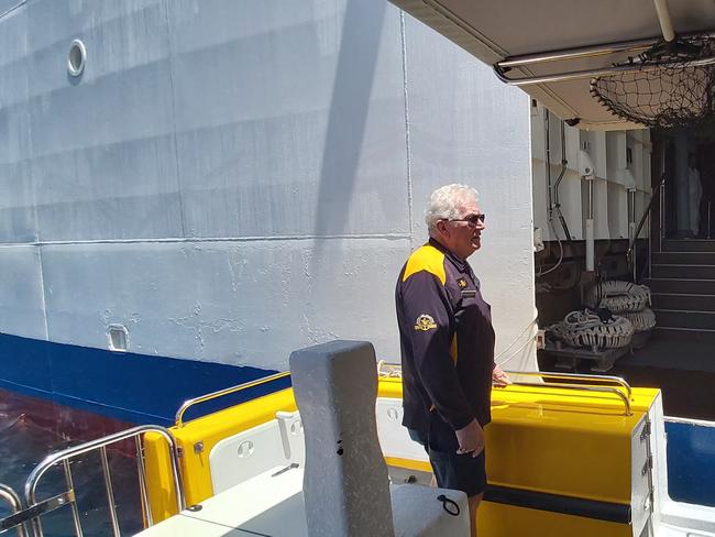 Skipper Kingsley Bartle on Yeppoon Rescue One 'docked' to the cruise ship