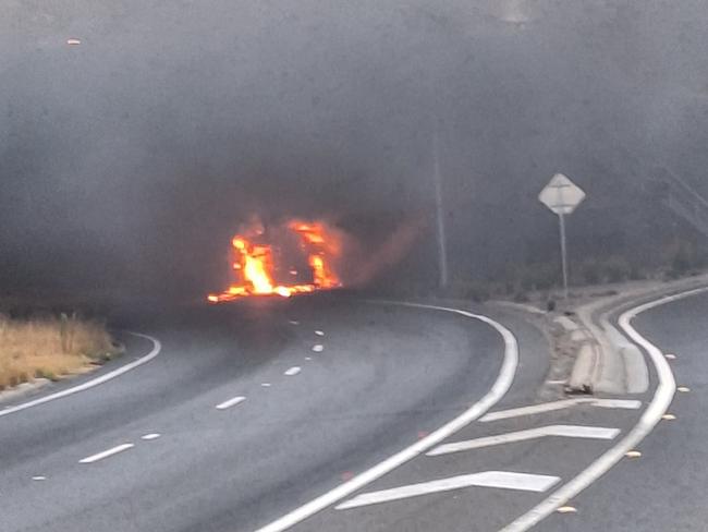 A driver has miraculously escaped injury after his truck burst into flames on the Tullamarine Fwy. Picture: Glenn P