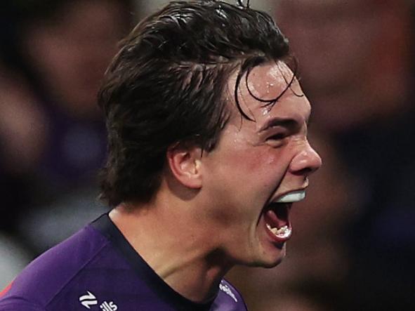 MELBOURNE, AUSTRALIA - AUGUST 24: Jack Howarth of the Storm celebrates scoring a try during the round 25 NRL match between Melbourne Storm and Dolphins at AAMI Park, on August 24, 2024, in Melbourne, Australia. (Photo by Daniel Pockett/Getty Images)