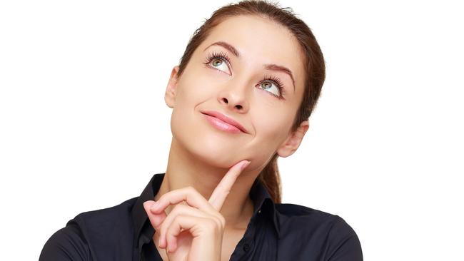 CAREERS: Business woman with colorful question mark and exclamation in balloons isolated on white background