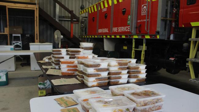 Corindi community members have been coordinating assistance from the Corindi RFS shed, organising meals for families which have been donated by local businesses. Photo: Tim Jarrett