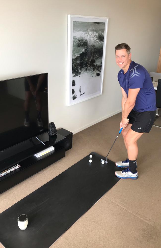 Josh Holt practising his putting skills at home.