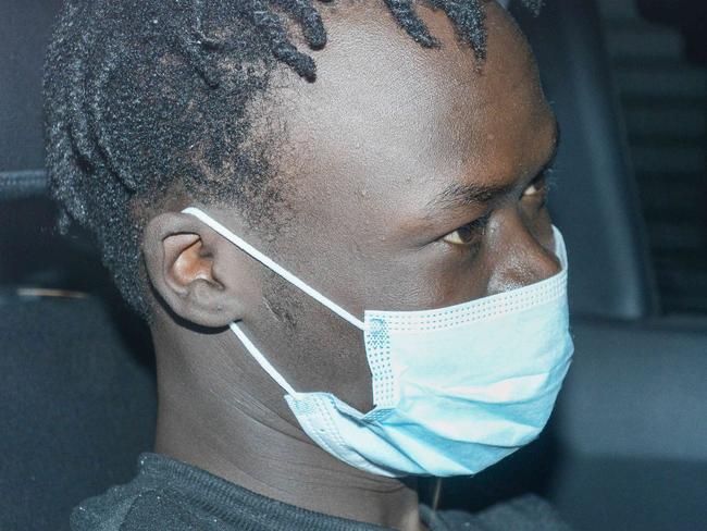 APRIL 7, 2022: SA Police escort Mathiang Malok back to Adelaide from Melbourne to face charges including attempted murder in relation to a violent brawl in the city last month. Picture: Brenton Edwards