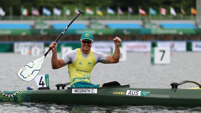 Curtis McGrath celebrates his gold medal in the canoe sprint.