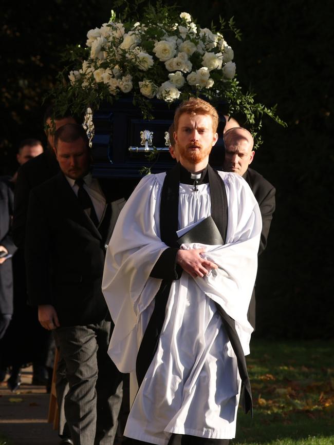 A priest led the procession of the singer’s coffin outside the church. Picture: Dan Kitwood/Getty Images