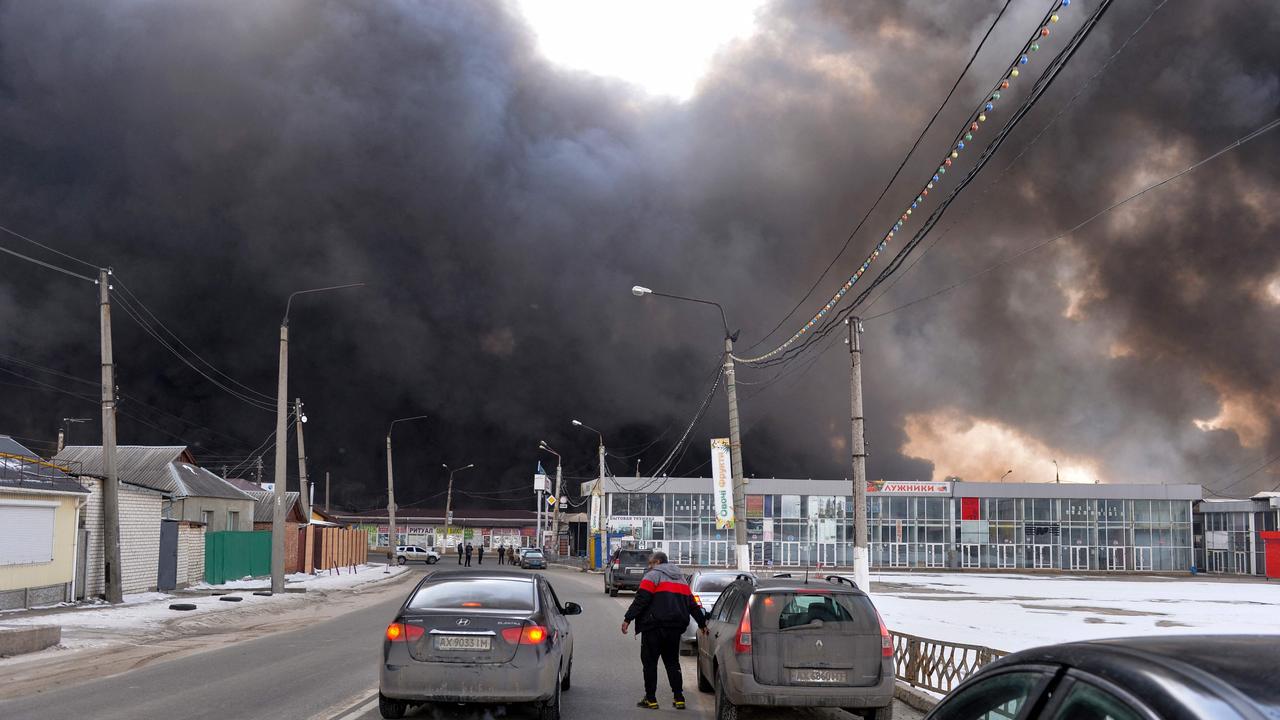 Black smoke rises into the sky from the Barabashovo market – one of the largest markets in the eastern Europe, located in Kharkiv Picture: Sergey Bobok/AFP