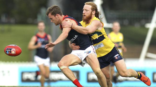 Woodville-West Torrens forward Angus Poole tackles Norwood's Zac Richards. Picture: AAP//Dean Martin